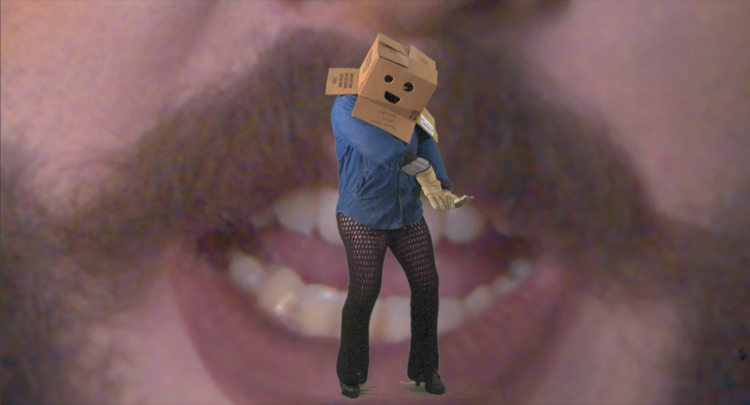 A person wears a cardboard box with a face drawn on it and is dancing. The background image is a person's open mouth.