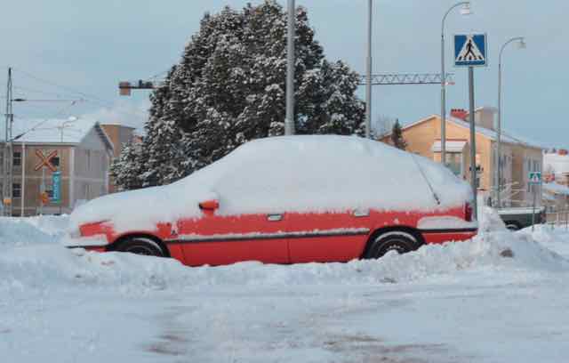 A car buried in snow in Finland. 