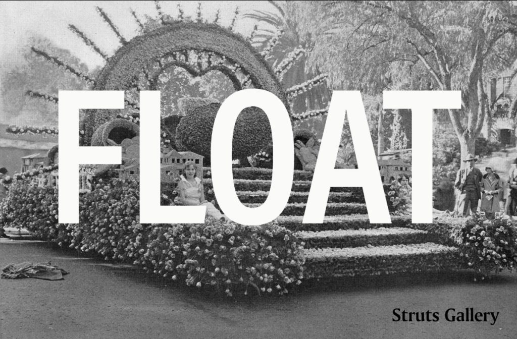 A black and white image of a float with the word "FLOAT" in white text over it.