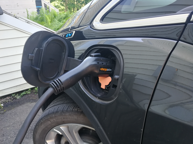 A charging port on an electric vehicle.